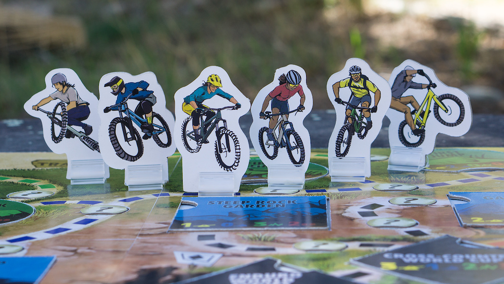 The SEND IT game riders L to R Dirt Jump Delilah Downhill Derek Enduro Elsa Cross-Country Carrie Singletrack Sammy Trials Terrance. SEND IT is now available on Kickstarter. Reserve your game now https www.senditboardgames.com kickstarter 